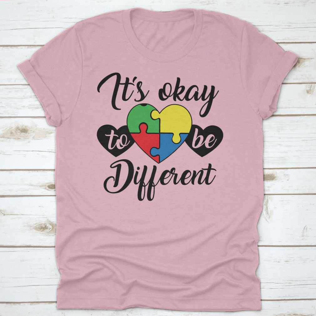 A soft, comfortable T-shirt featuring the phrase 'It's Okay To Be Different' in a stylish design, perfect for casual wear.