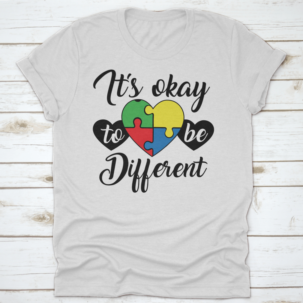 A soft, comfortable T-shirt featuring the phrase 'It's Okay To Be Different' in a stylish design, perfect for casual wear.