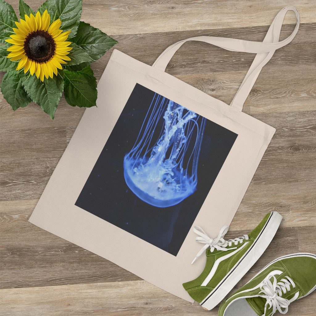 A colorful Jellyfish Tote Bag made of 100% cotton with long handles and cross-stitched detailing.