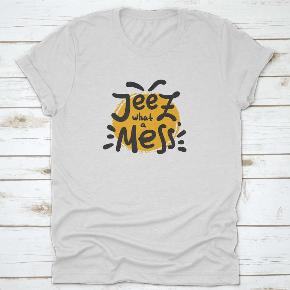 A comfortable t-shirt featuring the funny motivational quote 'Jeez What A Mess', made from high-quality cotton.