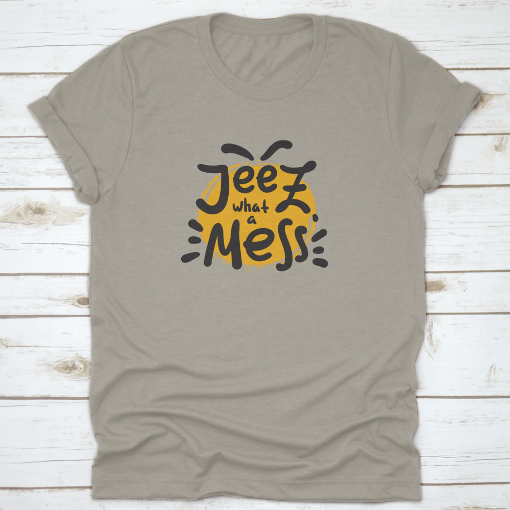 A comfortable t-shirt featuring the funny motivational quote 'Jeez What A Mess', made from high-quality cotton.