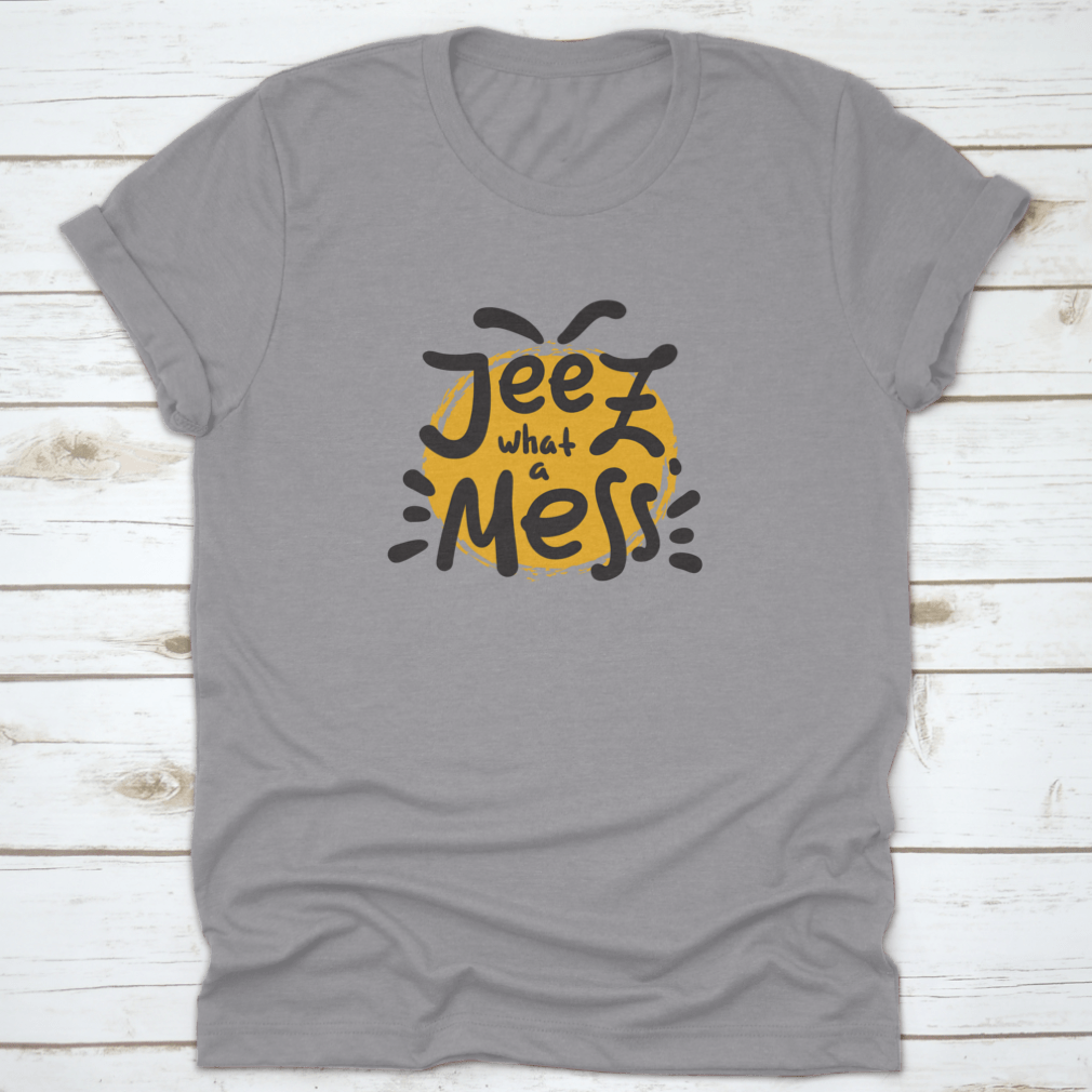 A comfortable t-shirt featuring the funny motivational quote 'Jeez What A Mess', made from high-quality cotton.