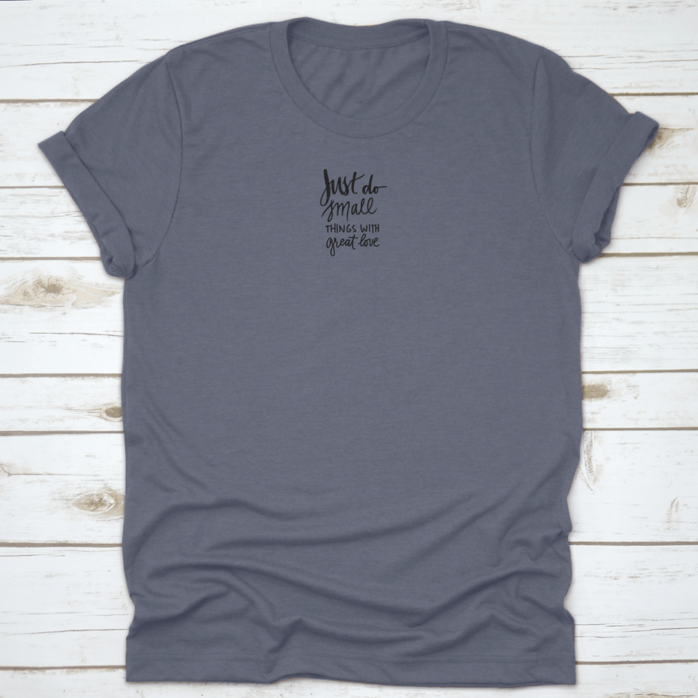 A soft cotton t-shirt featuring the inspiring phrase 'Just Do Small Things With Great Love' in a stylish font, perfect for casual wear.