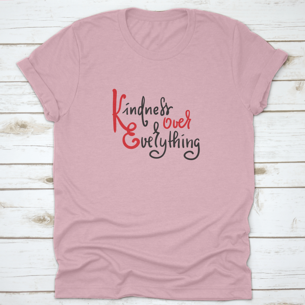 A hand-drawn motivational quote t-shirt featuring 'Kindness Over Everything' in stylish typography, made from soft cotton fabric.