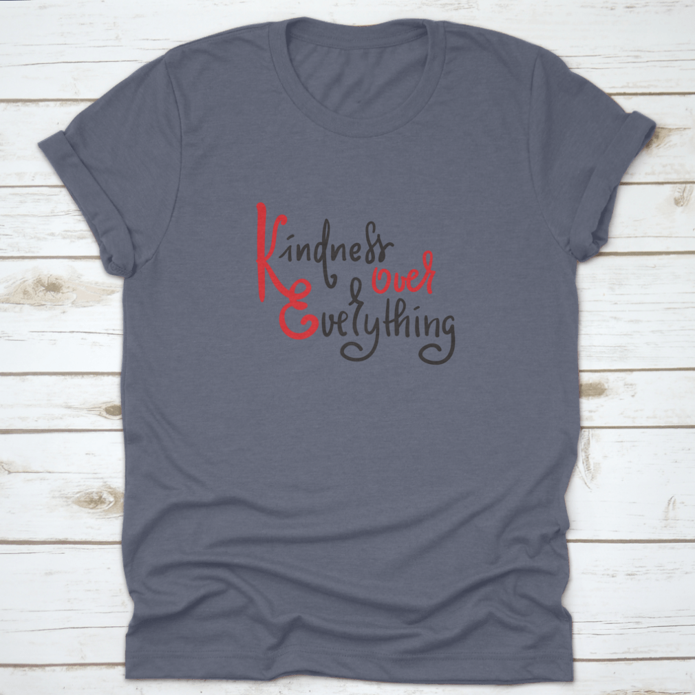 A hand-drawn motivational quote t-shirt featuring 'Kindness Over Everything' in stylish typography, made from soft cotton fabric.