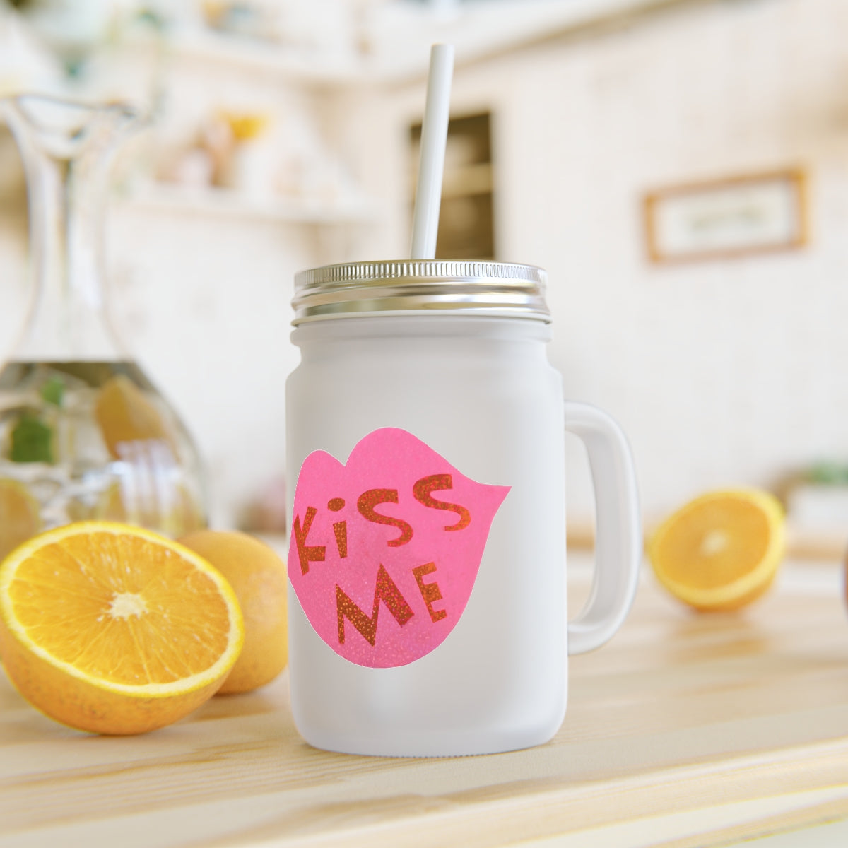 A personalized Kiss Me Mason Jar made of frosted glass, featuring a straw and lid, perfect for drinks.