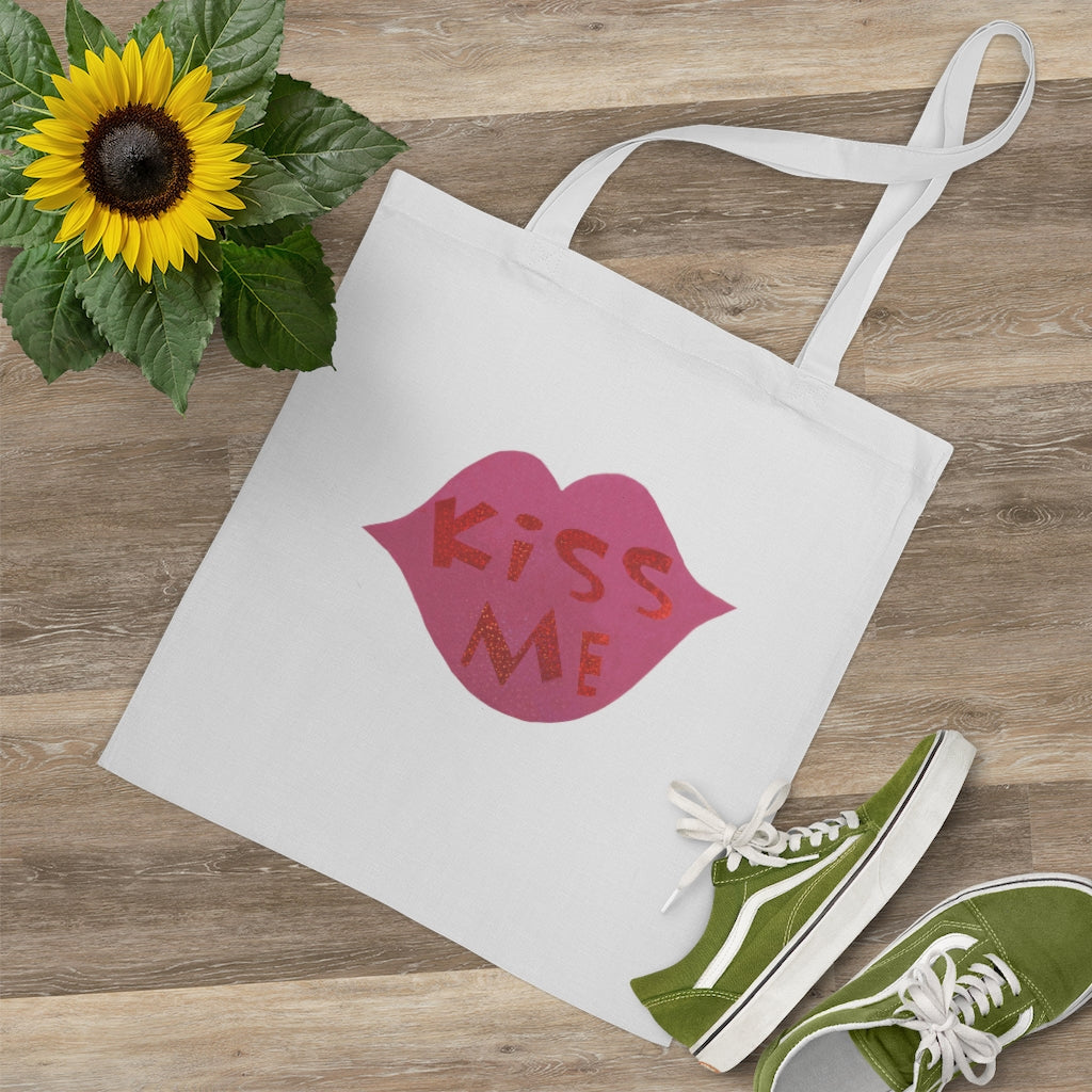 Kiss Me Tote Bag made of 100% cotton with long handles and cross stitching, available in multiple colors.