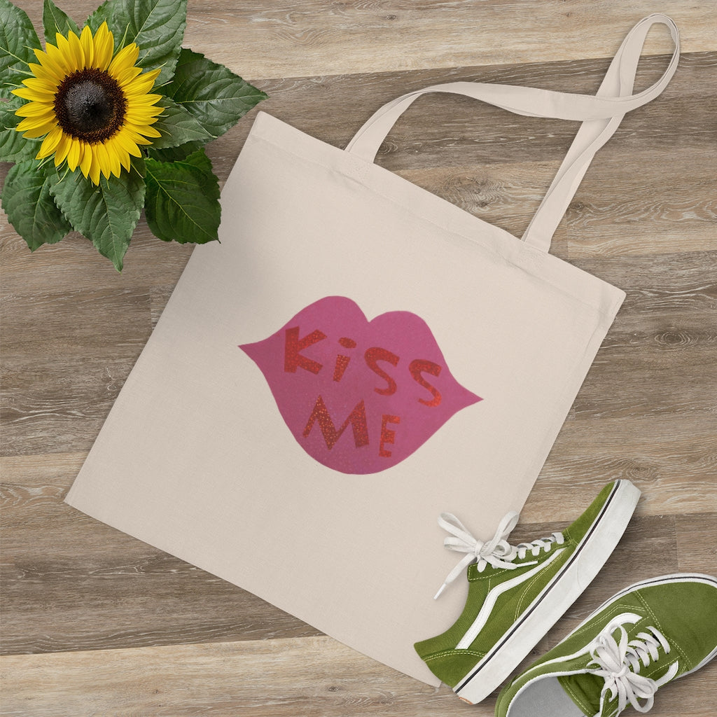 Kiss Me Tote Bag made of 100% cotton with long handles and cross stitching, available in multiple colors.