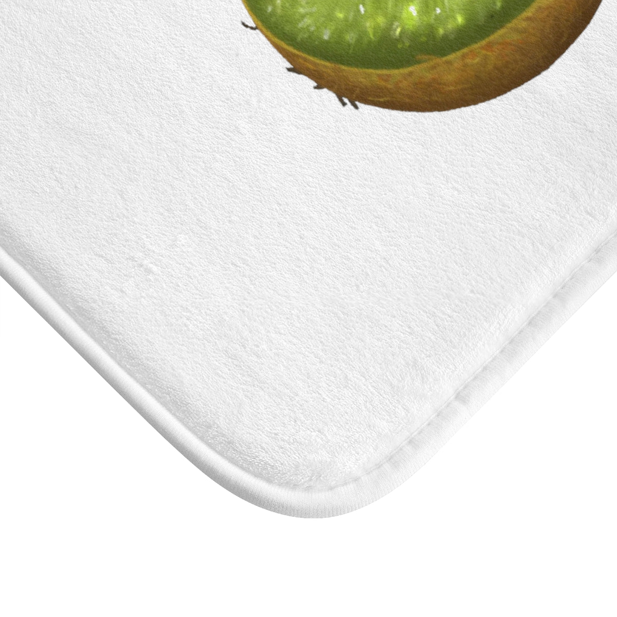 A vibrant kiwi green bath mat with anti-slip backing, showcasing its soft microfiber texture and durable edge binding.