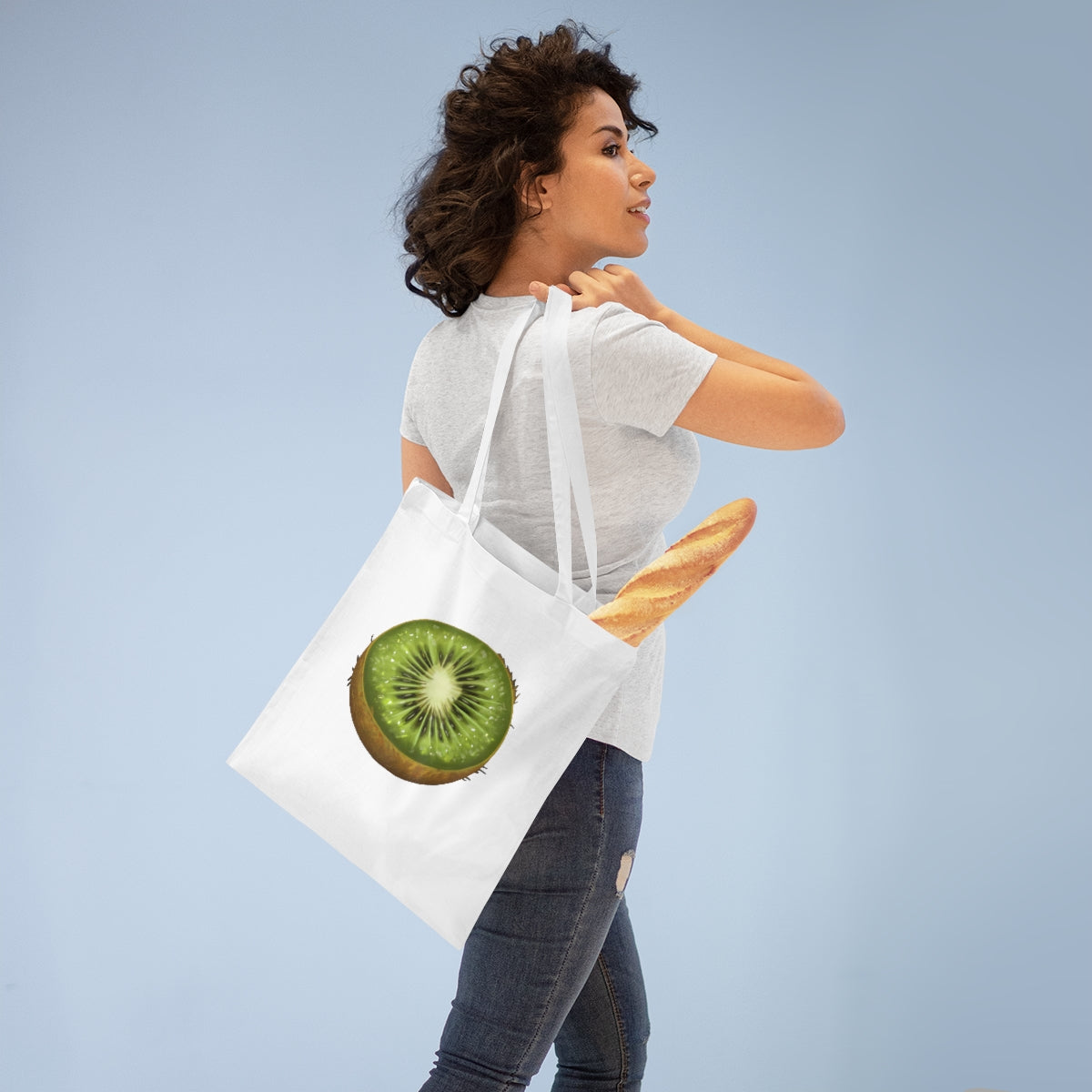 A vibrant Kiwi Tote Bag made of 100% cotton with long handles and cross-stitched detailing, showcasing multiple color options.