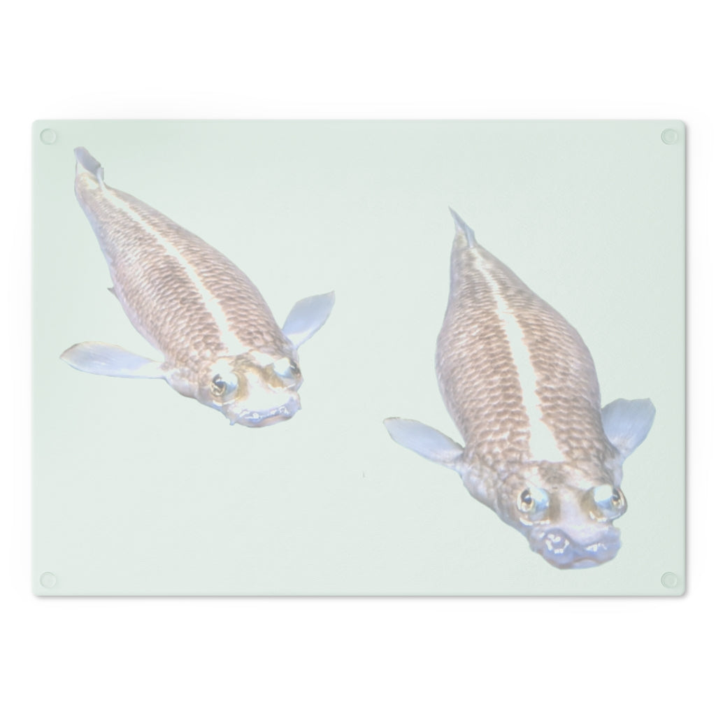 A beautifully designed Koi Fish Cutting Board made of tempered glass, featuring a unique Koi fish pattern and rubber dots for stability.