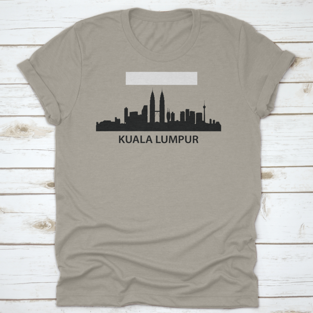 A stylish black print design t-shirt featuring Kuala Lumpur's iconic skyline, made from 100% cotton for comfort.