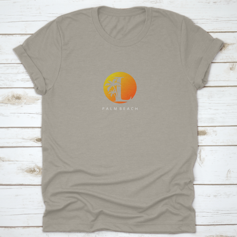 L Letter Palm Tree and Sun Set Logo Icon on a cotton shirt, showcasing a vibrant design perfect for surfing enthusiasts.