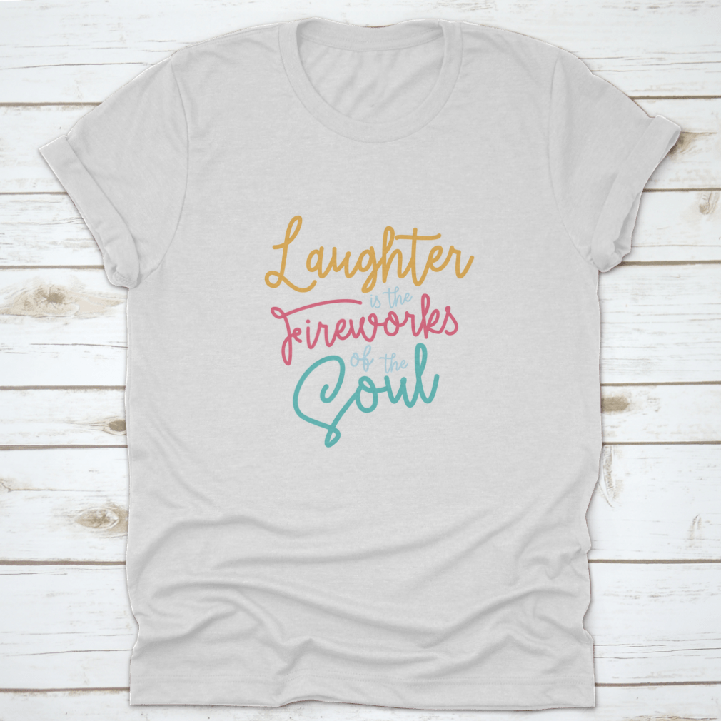 A motivational t-shirt featuring the phrase 'Laughter Is The Fireworks Of The Soul', made from soft cotton fabric.