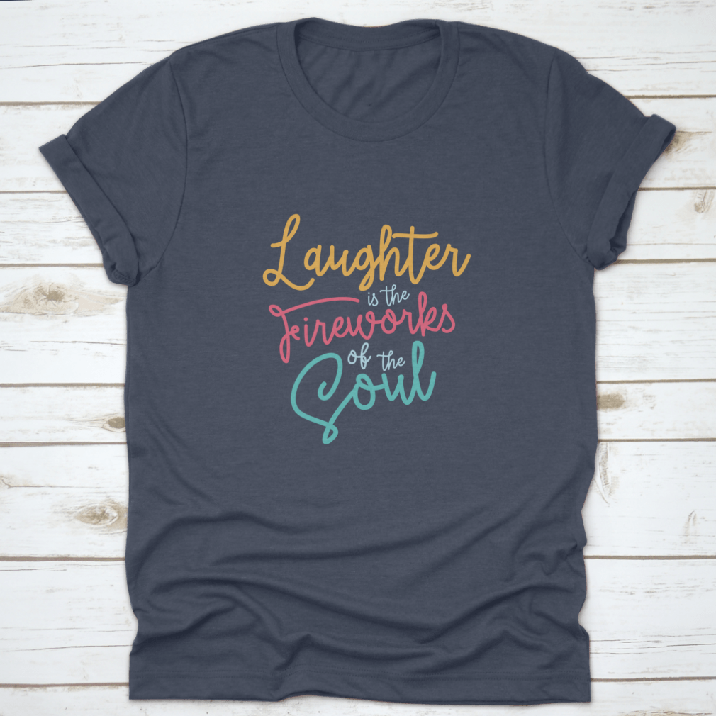 A motivational t-shirt featuring the phrase 'Laughter Is The Fireworks Of The Soul', made from soft cotton fabric.