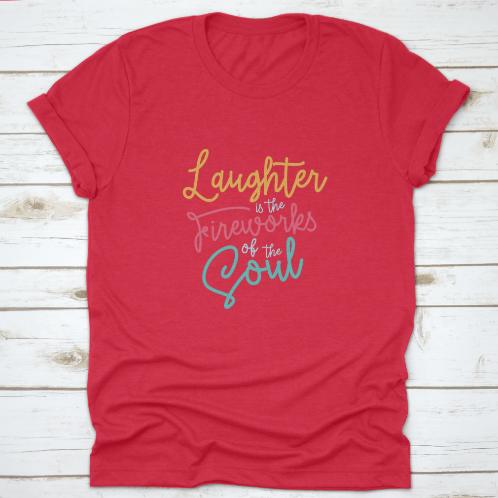 A motivational t-shirt featuring the phrase 'Laughter Is The Fireworks Of The Soul', made from soft cotton fabric.