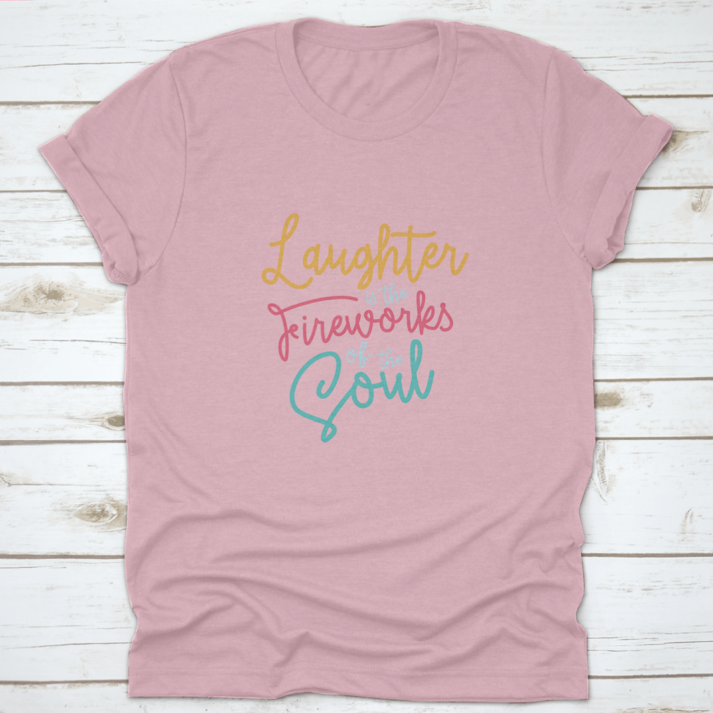 A motivational t-shirt featuring the phrase 'Laughter Is The Fireworks Of The Soul', made from soft cotton fabric.