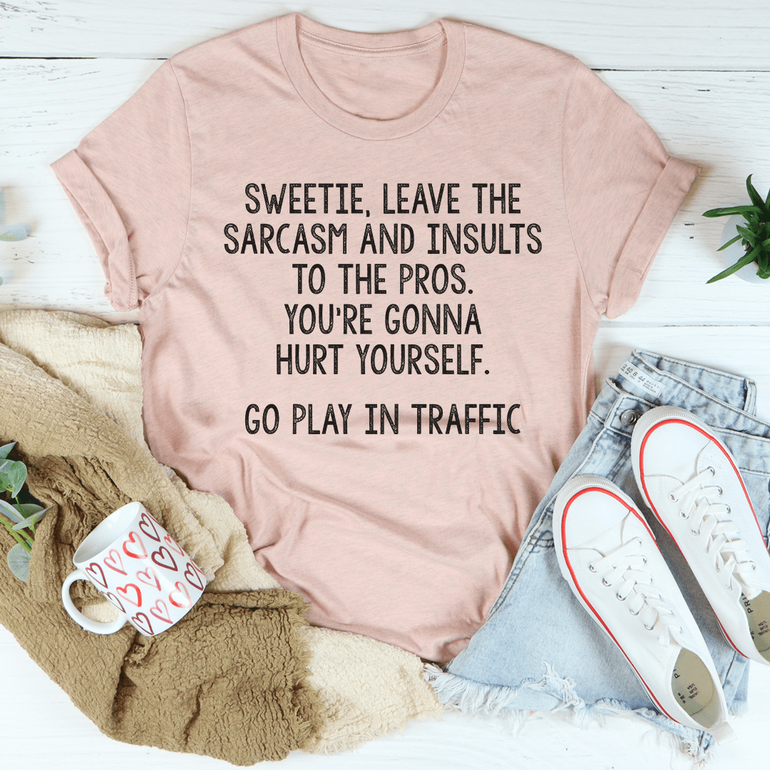 A comfortable and stylish t-shirt featuring the phrase 'Leave The Sarcasm And Insults To The Pros' printed on it, made from soft cotton.