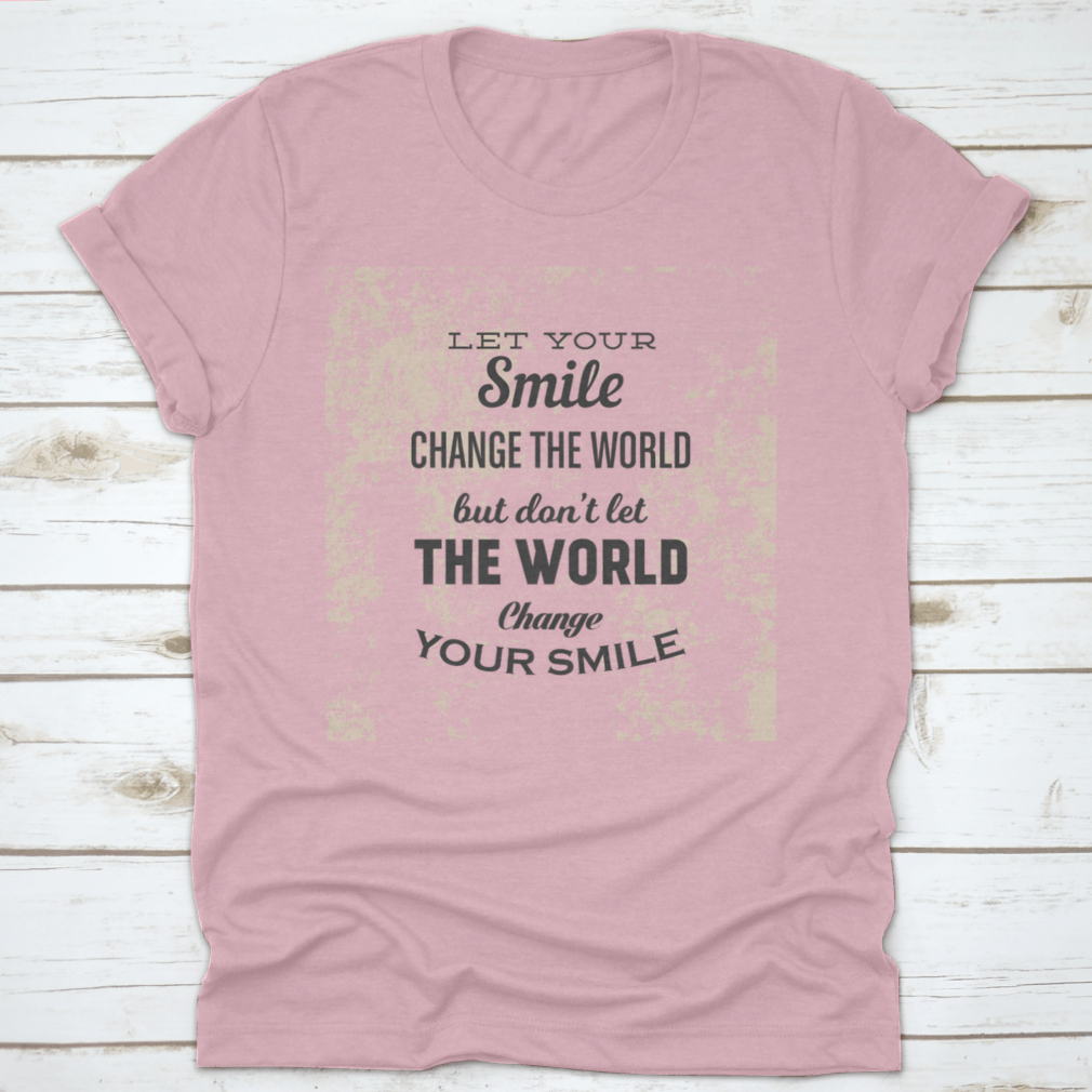 A stylish t-shirt featuring the phrase 'Let Your Smile Change The World' in a vibrant design, made from 100% cotton for comfort.