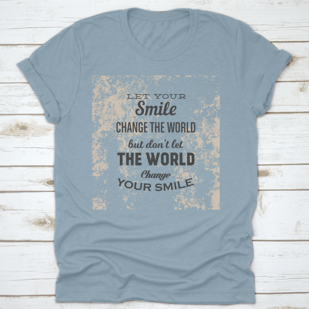 A stylish t-shirt featuring the phrase 'Let Your Smile Change The World' in a vibrant design, made from 100% cotton for comfort.