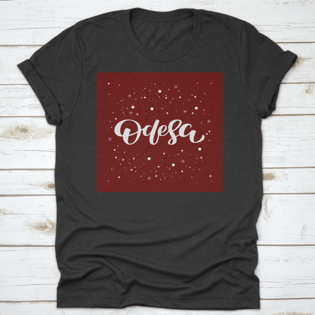 Odesa Lettering Text Design featuring a snowflake vector illustration on a comfortable cotton garment.