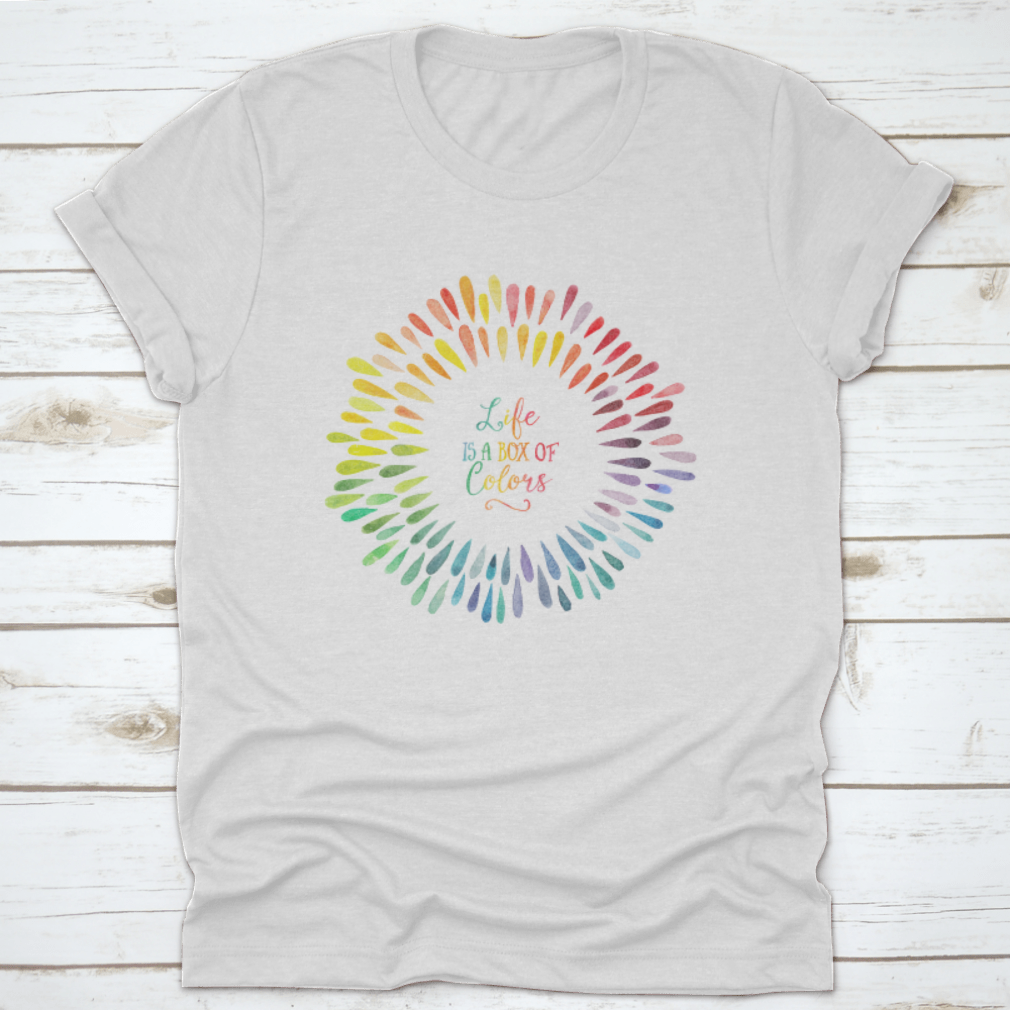 A stylish T-shirt featuring the motivational quote 'Life Is A Box Of Colors' in vibrant colors, made from 100% cotton for comfort.