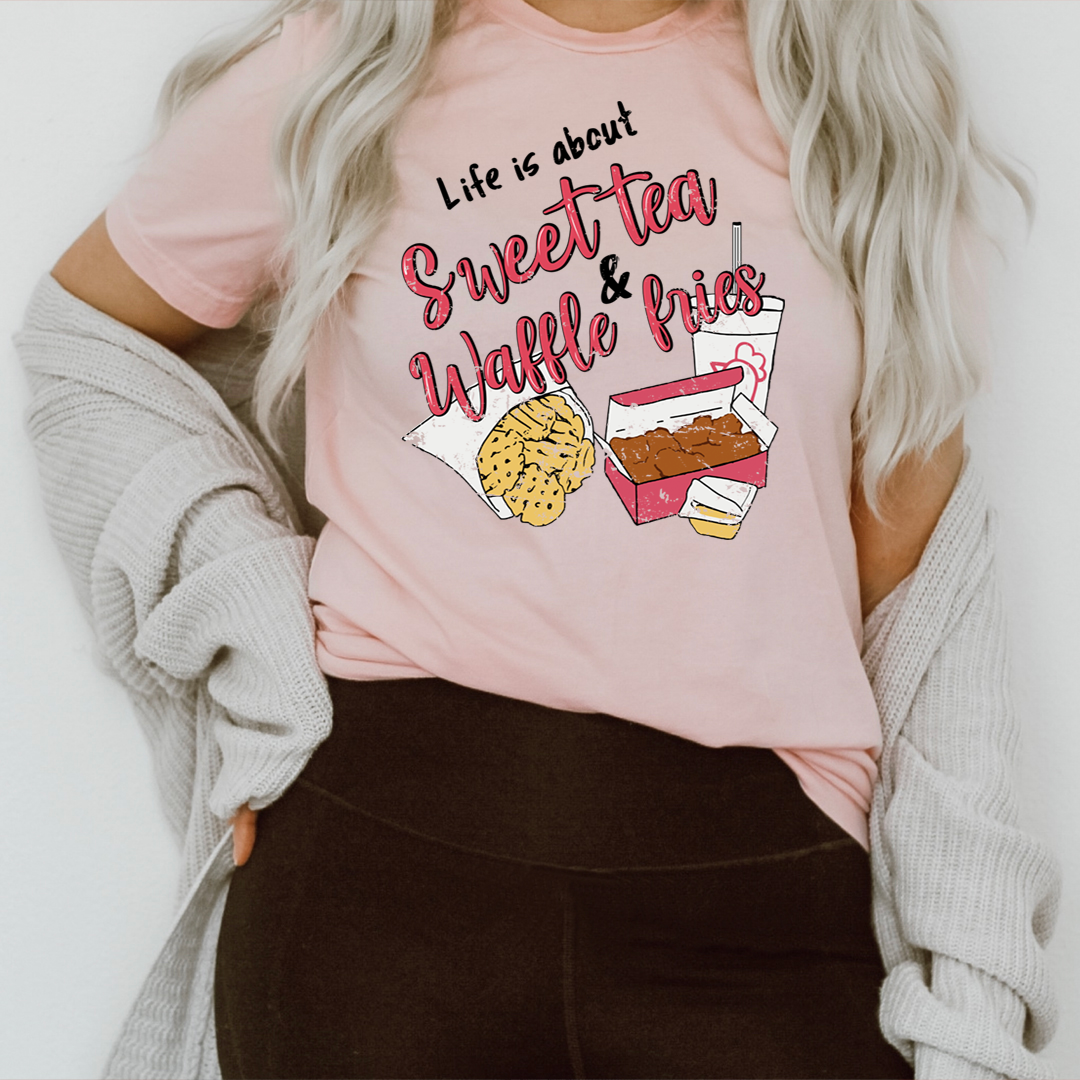 Life Is About Sweet Tea & Waffle Fries T-Shirt in a casual setting, showcasing its soft cotton fabric and vibrant print.