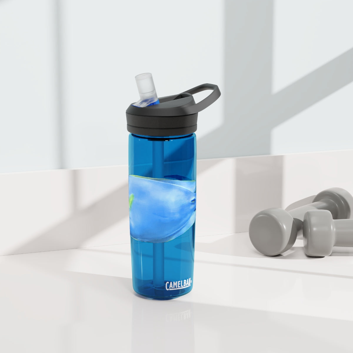 Light Blue and Yellow Fish CamelBak Eddy® Water Bottle, 20oz and 25oz sizes, featuring a spill-proof biting valve and easy-carry handle.