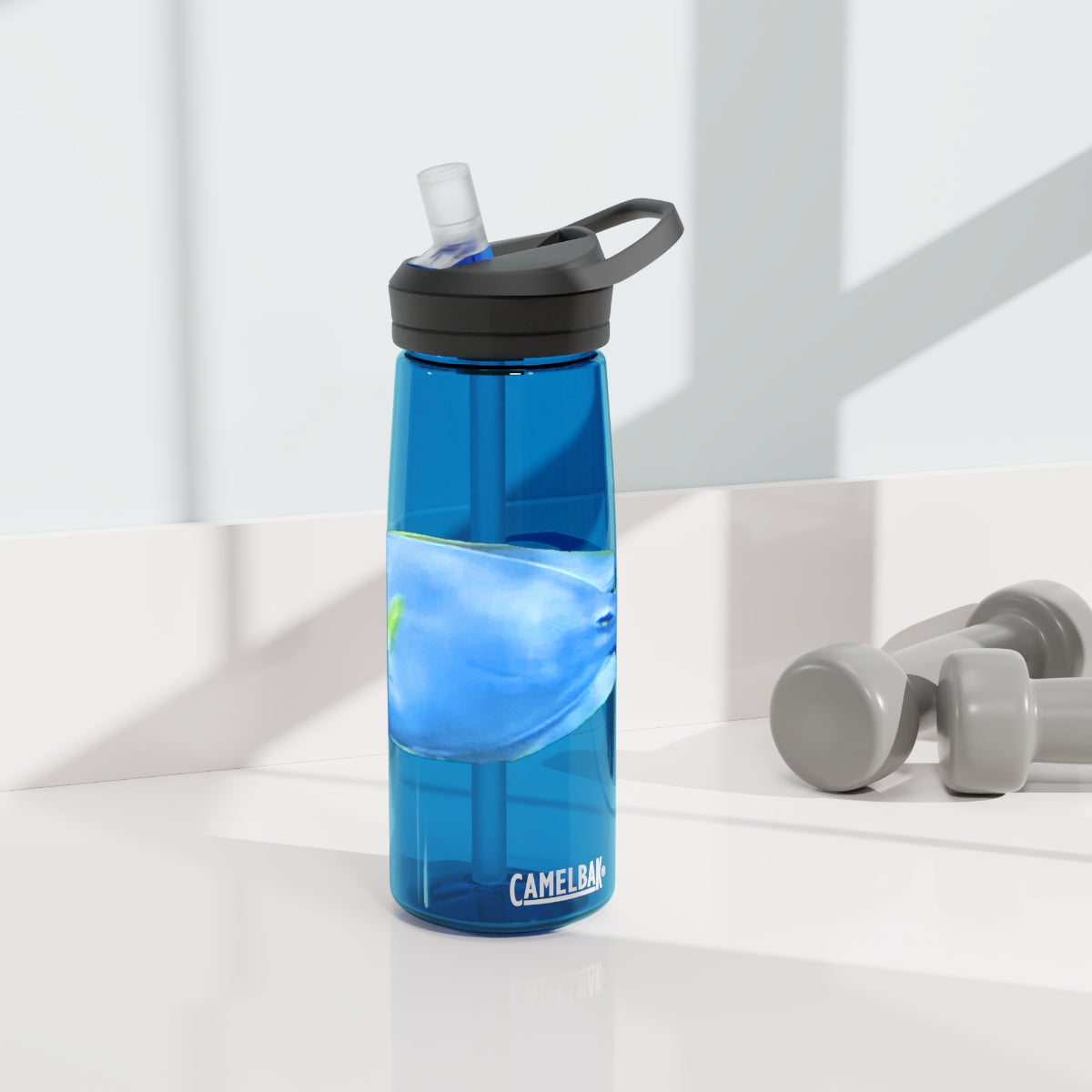 Light Blue and Yellow Fish CamelBak Eddy® Water Bottle, 20oz and 25oz sizes, featuring a spill-proof biting valve and easy-carry handle.