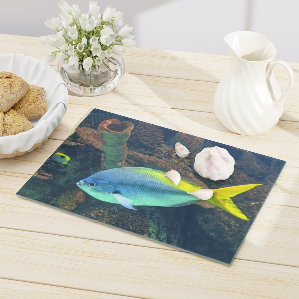 Light Blue and Yellow Fish Cutting Board made of tempered glass with rubber dots for stability.