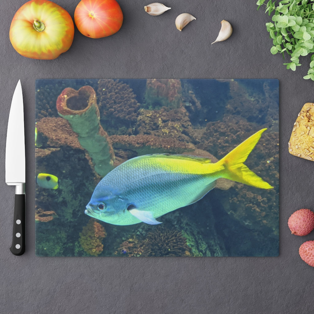 Light Blue and Yellow Fish Cutting Board made of tempered glass with rubber dots for stability.