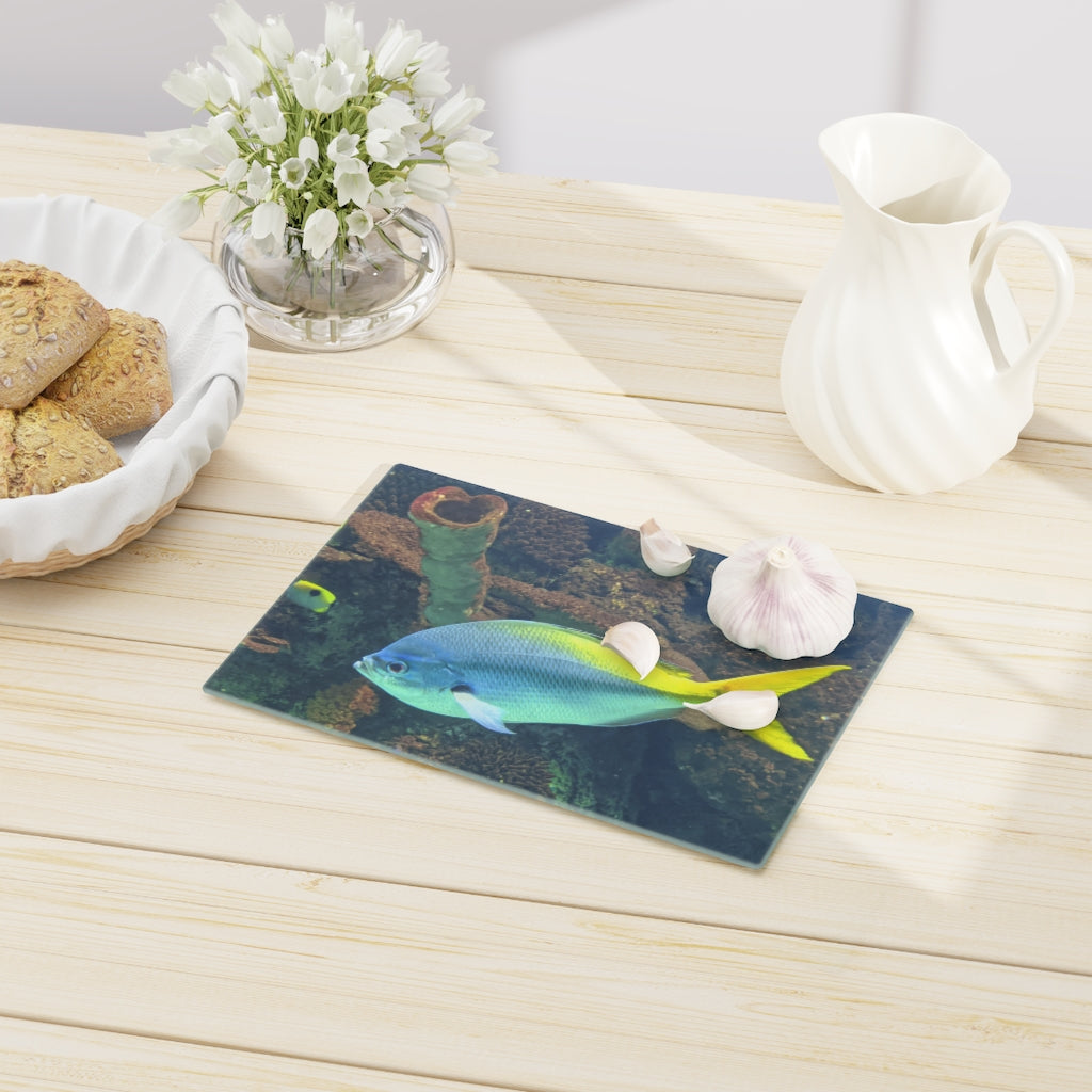 Light Blue and Yellow Fish Cutting Board made of tempered glass with rubber dots for stability.