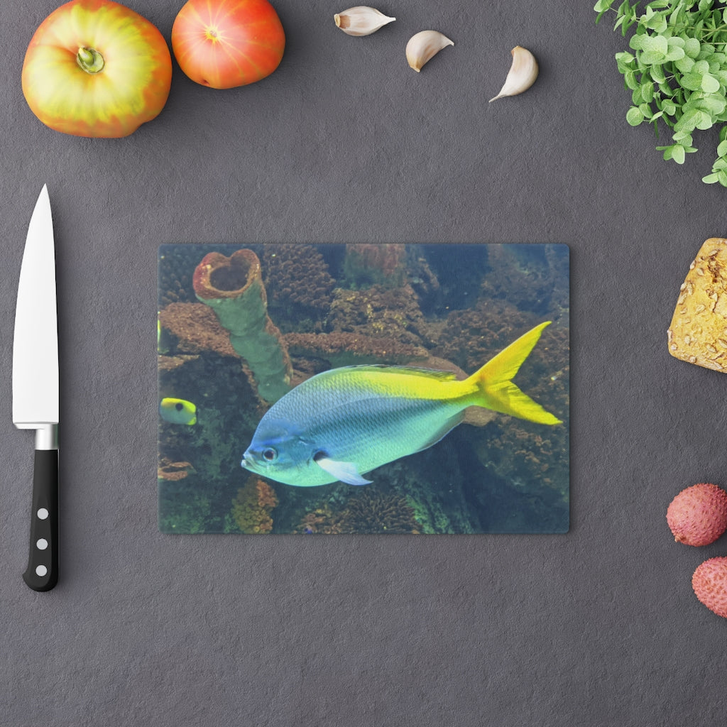 Light Blue and Yellow Fish Cutting Board made of tempered glass with rubber dots for stability.