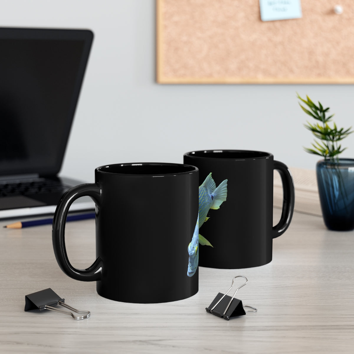 Light Blue Fish 11oz black ceramic mug with a C-handle, perfect for coffee, tea, or hot chocolate.