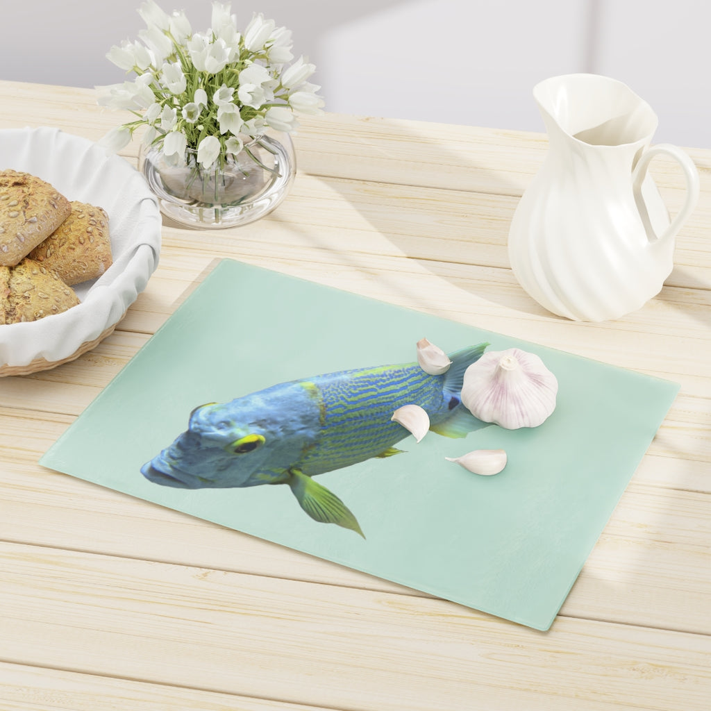 Light Blue Fish Cutting Board made of tempered glass with rubber dots for stability, featuring a unique fish design.