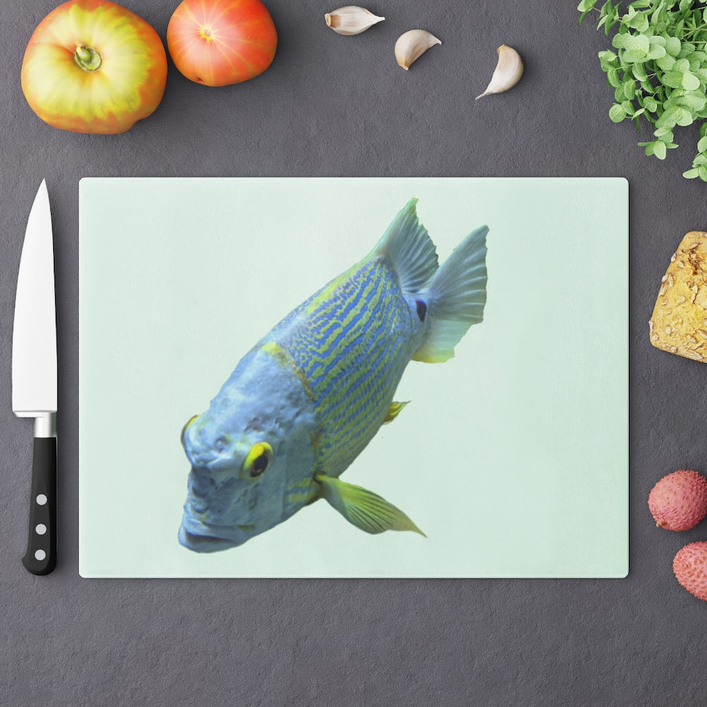 Light Blue Fish Cutting Board made of tempered glass with rubber dots for stability, featuring a unique fish design.