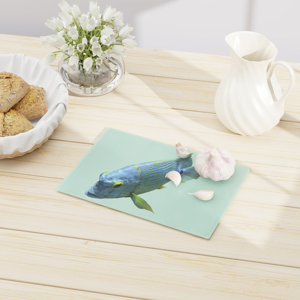 Light Blue Fish Cutting Board made of tempered glass with rubber dots for stability, featuring a unique fish design.