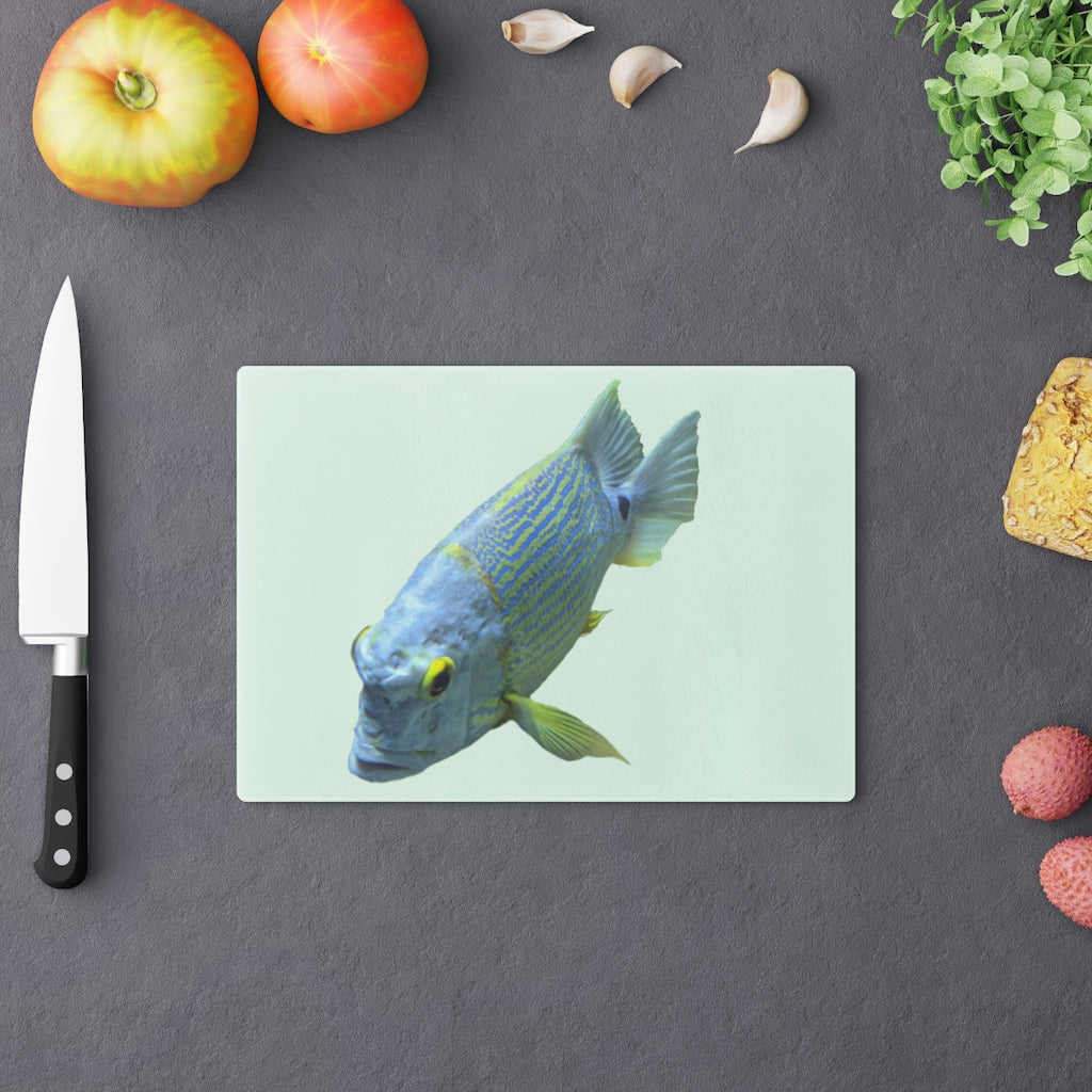 Light Blue Fish Cutting Board made of tempered glass with rubber dots for stability, featuring a unique fish design.