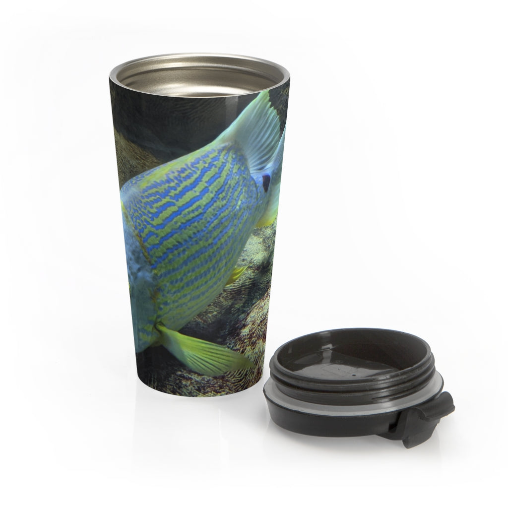 Light Blue Fish Stainless Steel Travel Mug with a stylish fish design and black plastic lid, perfect for coffee and tea lovers.