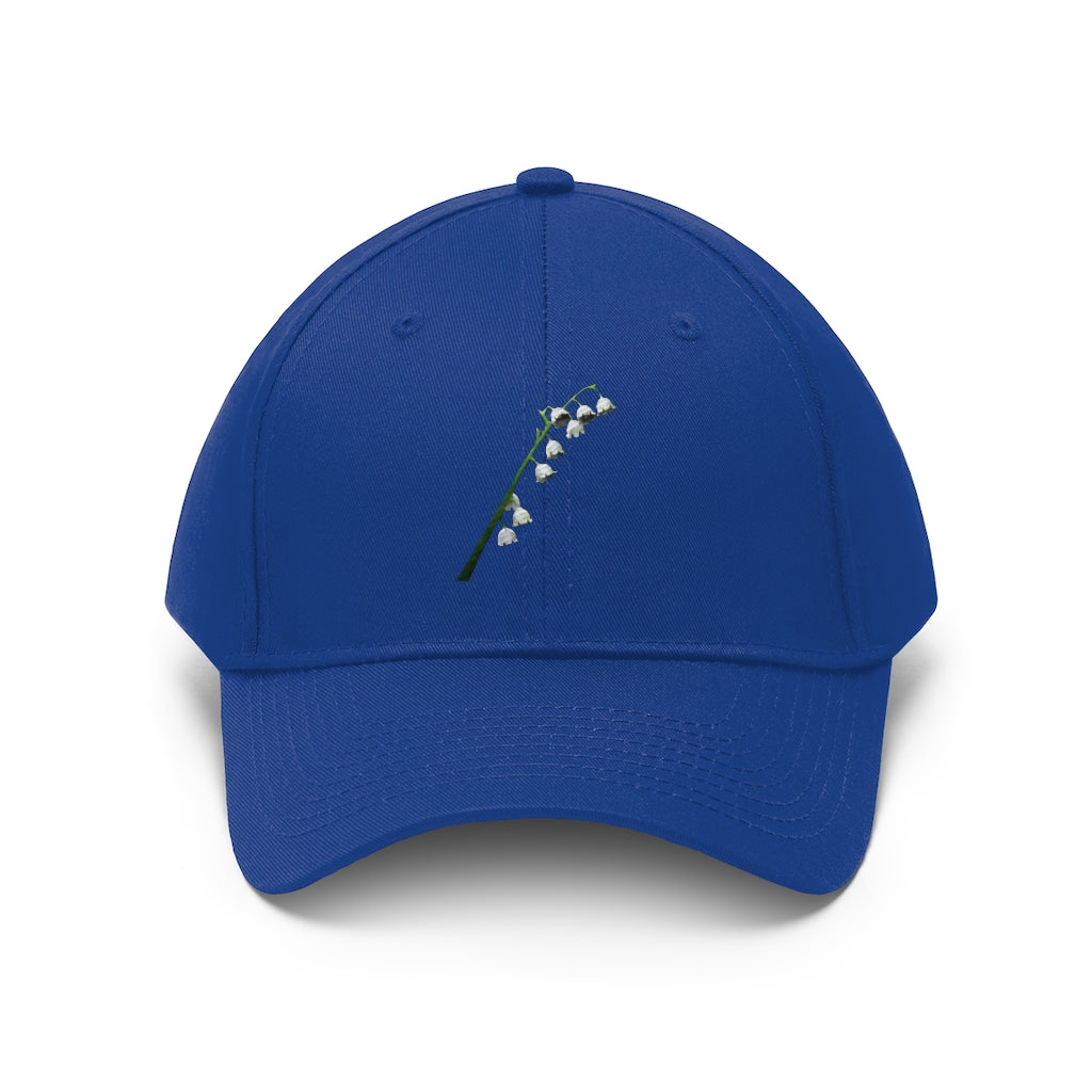 Lilly Unisex Twill Hat showcasing its 6-panel design and adjustable Velcro closure, made from 100% cotton twill.