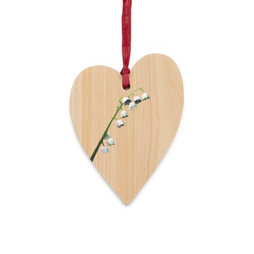 Lilly Wooden Christmas Ornaments in various whimsical shapes with red ribbons, showcasing rustic wooden design.