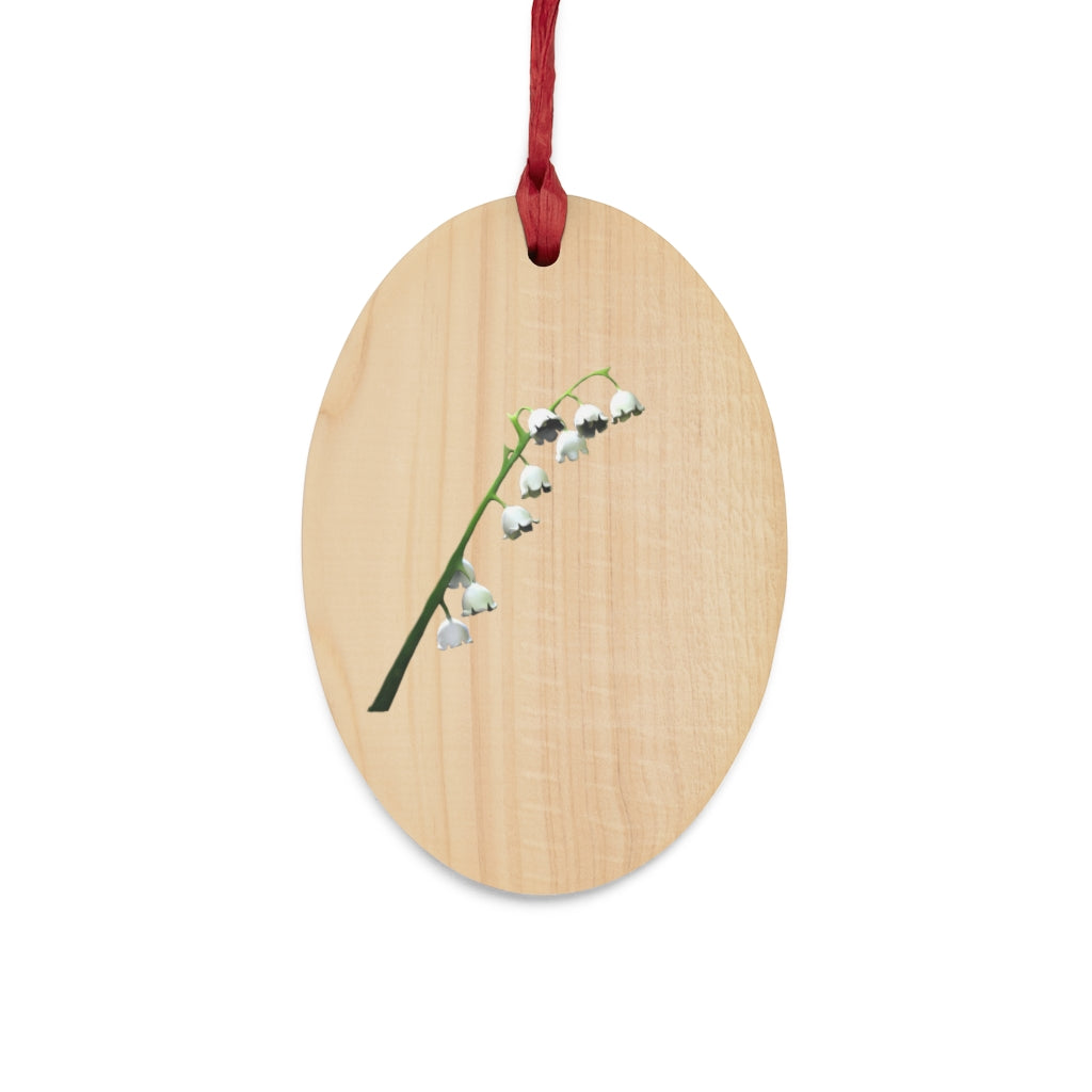 Lilly Wooden Christmas Ornaments in various whimsical shapes with red ribbons, showcasing rustic wooden design.