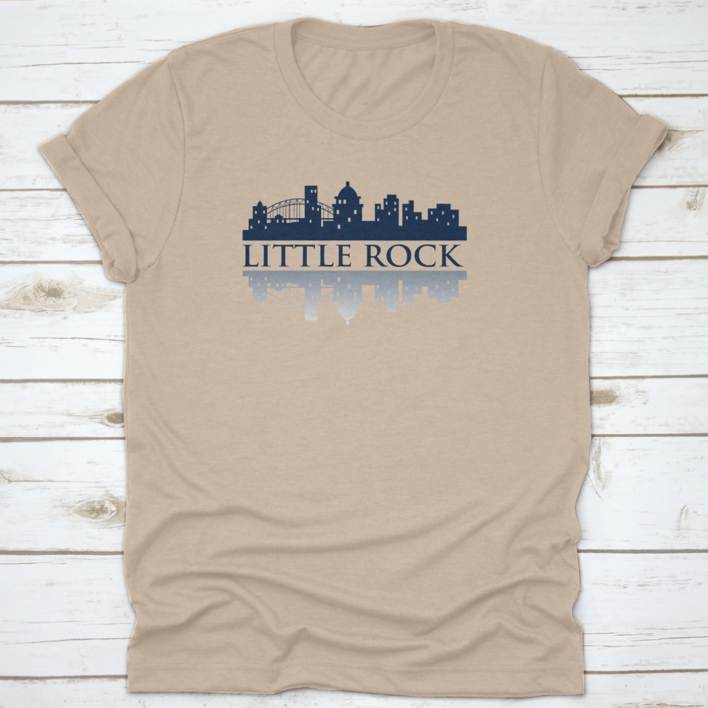 A trendy Little Rock Skyline City Logo T-Shirt displayed on a mannequin, showcasing its classic fit and vibrant skyline design.