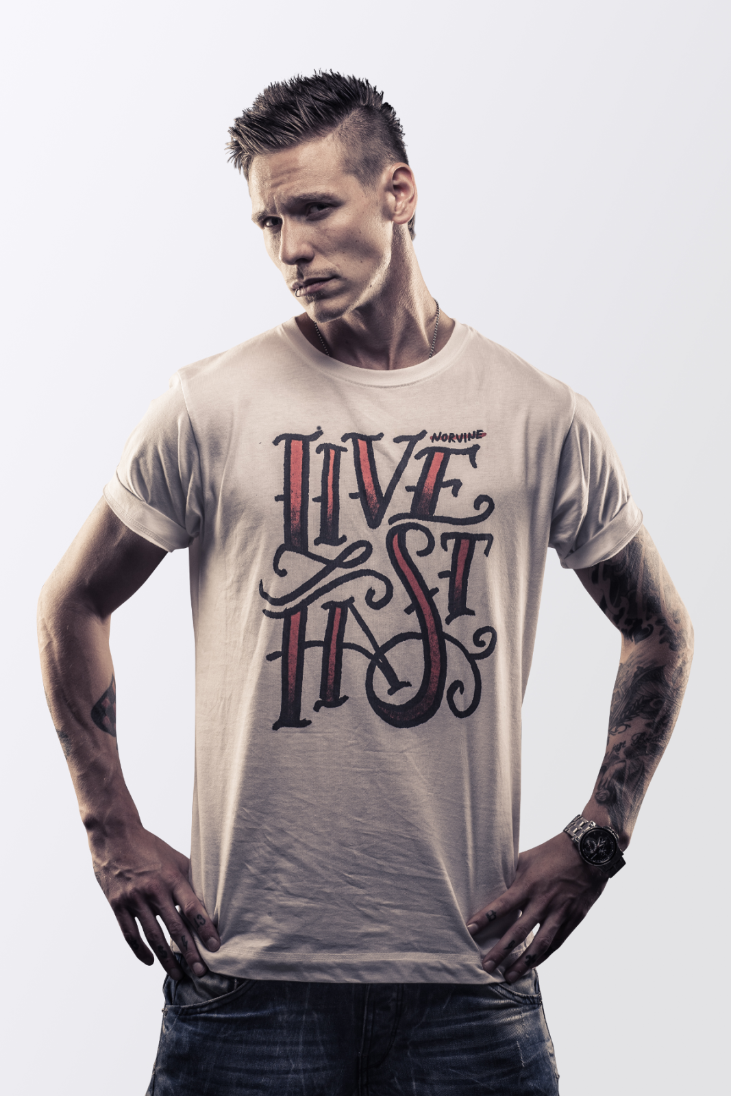 A premium white t-shirt featuring the Norvine logo on the back, made from 100% combed cotton with a slim fit design.