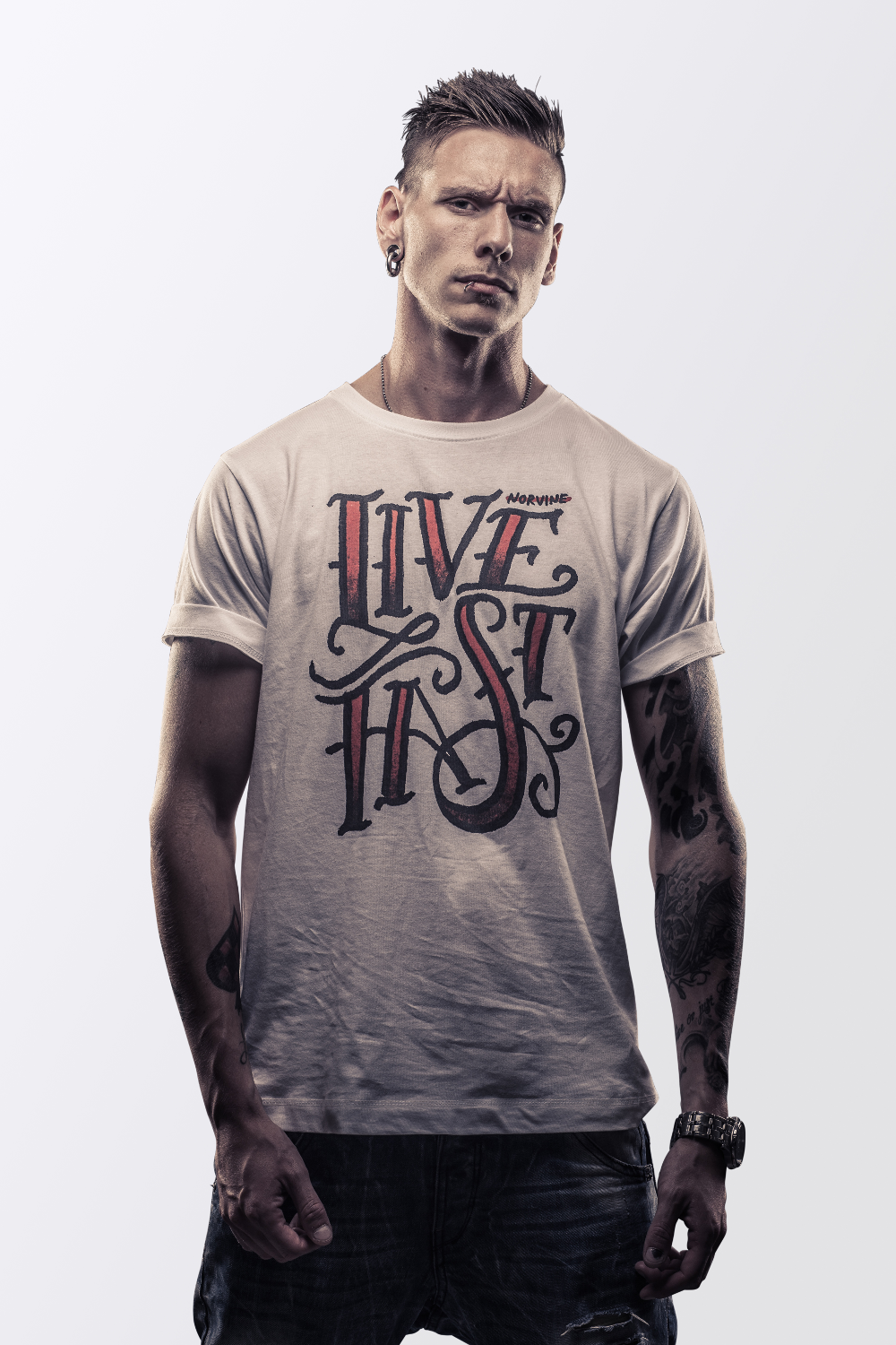 A premium white t-shirt featuring the Norvine logo on the back, made from 100% combed cotton with a slim fit design.