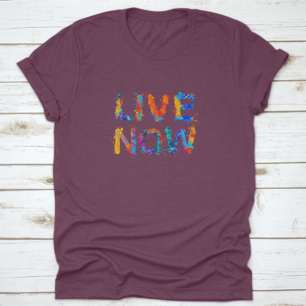 Live Now motivational t-shirt featuring a vibrant splash paint design, made from 100% cotton for comfort and style.