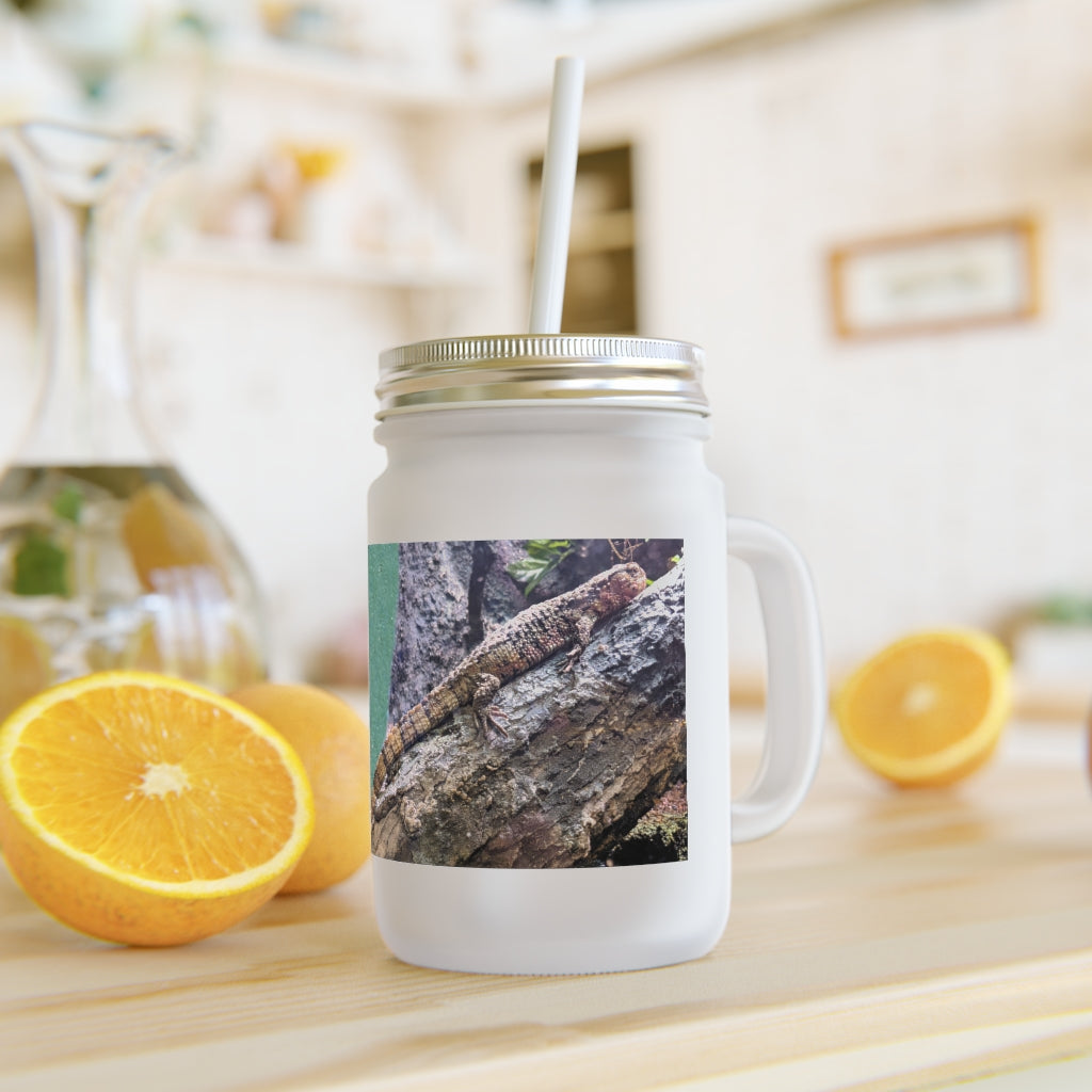 A stylish Lizard Mason Jar made of frosted glass, featuring a straw and lid, perfect for personalized drinks.