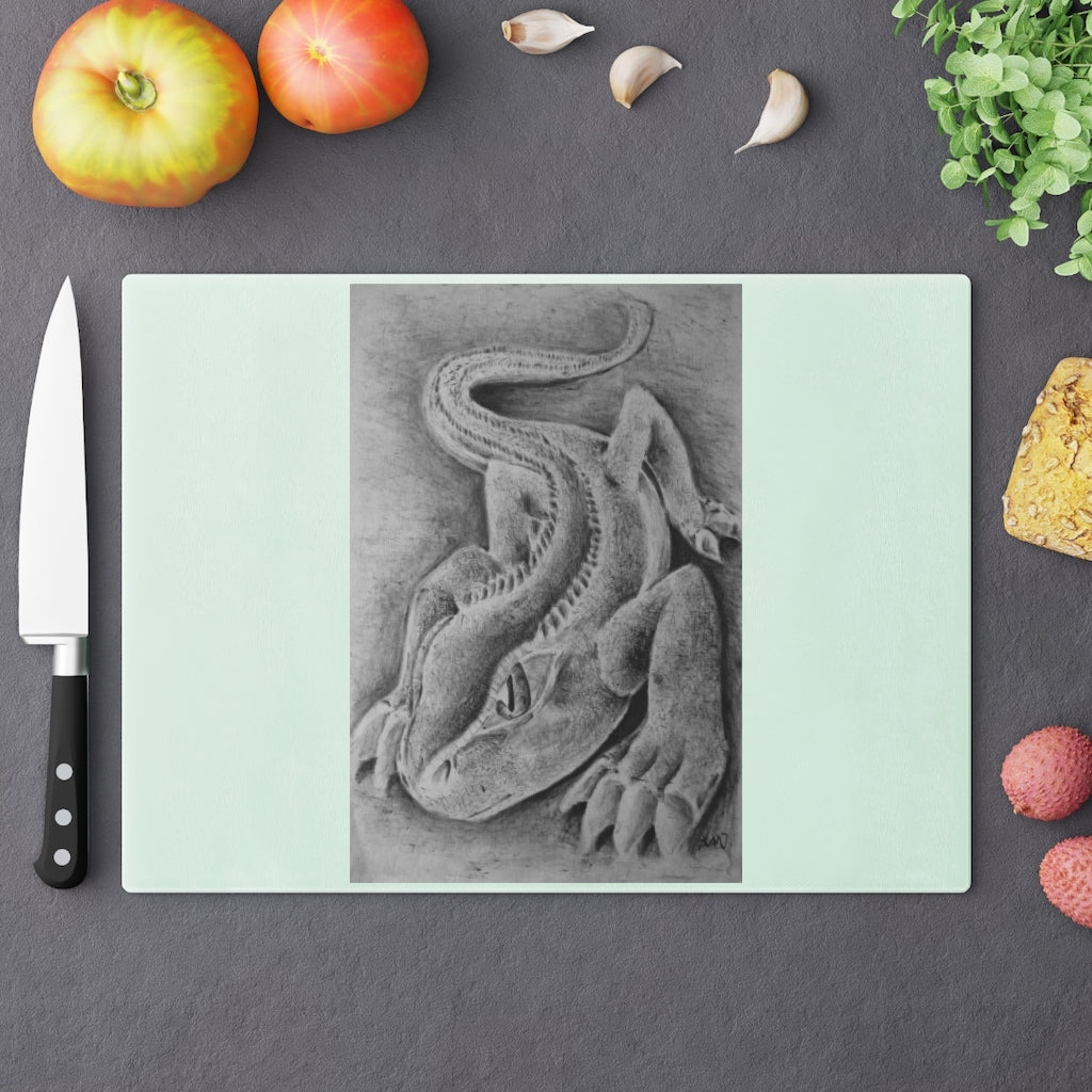 Lizzy the Lizard Cutting Board made of tempered glass with a unique lizard design and rubber dots for stability.