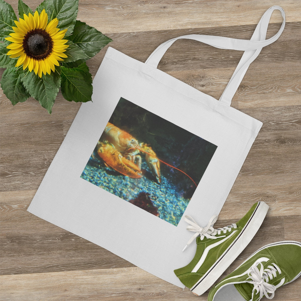 A colorful Lobster Tote Bag made of 100% cotton with long handles and cross stitching for durability, perfect for everyday use.