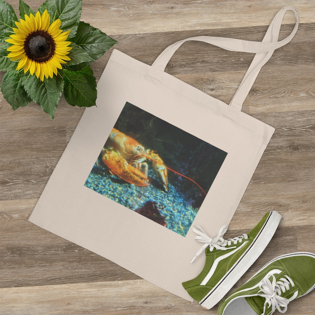 A colorful Lobster Tote Bag made of 100% cotton with long handles and cross stitching for durability, perfect for everyday use.